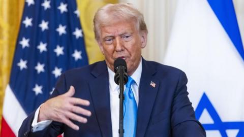 US President Donald Trump speaks during a press conference