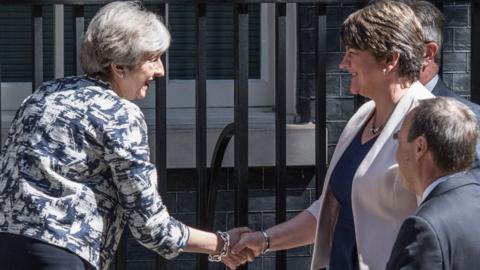 UK PM Theresa May and DUP leader Arlene Foster shake hands outside Downing Street on 26 June 2017
