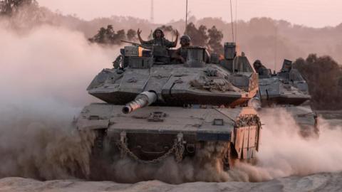 Israeli soldiers in a tank near the Gaza border (file photo)