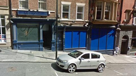 An external picture of Blue Velvet on Dean Street. The windows of the club have been painted blue.