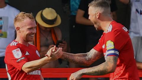 Adam Campbell of Crawley Town celebrates with Ben Gladwin