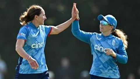 Kate Cross (left) and Tammy Beaumont celebrate a wicket for England