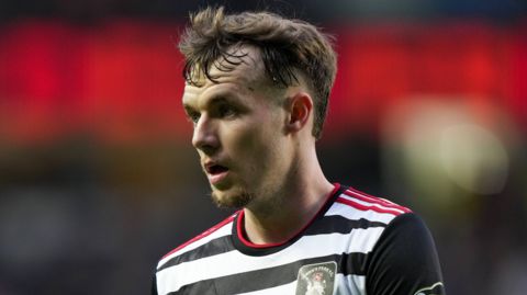 Kyle Hurst, wearing the black and white striped shit of Queens Park, during a Scottish Cup game against Rangers in 2025