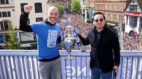 Former Leicester boss Enzo Maresca lifts the Championship trophy with owner Aiyawatt Srivaddhanaprabha during Leicester's title parade last season