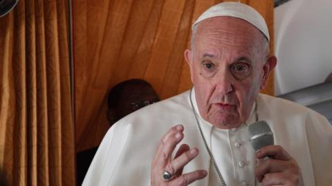 Pope Francis speaking to reporters on a plane