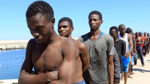 Illegal immigrants from Africa, lined up on the way to a detention centre in Libya