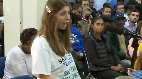 Lady at town hall meeting