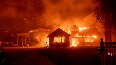 A home burns during the Hillside fire in the North Park neighbourhood of San Bernardino, California on October 31, 2019