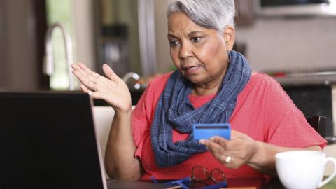 stock image of an older woman at a computer