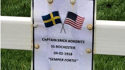 plaque on the cross where Captain Kokeritz is buried