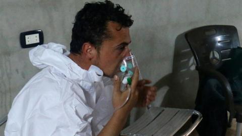 A man breathes through an oxygen mask after what rescue workers described as a suspected gas attack in the town of Khan Sheikhoun in rebel-held Idlib, Syria April 4, 2017.