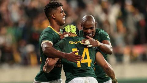 South Africa players celebrate a try against Italy