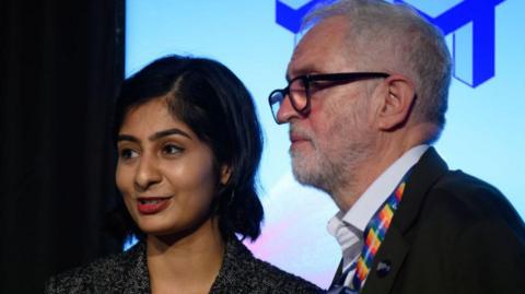 Zarah Sultana speaks with former Labour Party leader Jeremy Corbyn after addressing an audience at a fringe event for political festival The World Transformed.