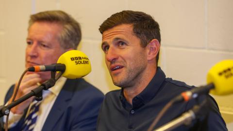 Portsmouth boss John Mousinho speaking at BBC Radio Solent's fan forum in 2024