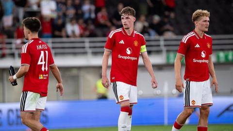Tyler Fletcher, Harry Amass and Jacob Devaney on the pitch during Manchester United's pre-season game against Wrexham in Helsinki