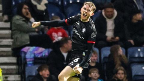 Max Bird celebrates after scoring Bristol City's third goal at Preston