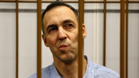 French researcher Laurent Vinatier is seen in an enclosure for defendants in a court in Moscow, Russia. Photo: 14 October 2024