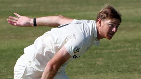 Worcestershire's Tom Taylor bowls