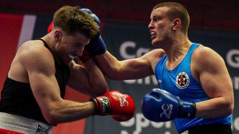 David Francis (R) lands a blow on Joshua Taylor