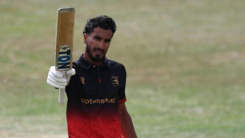 Hamza Shaikh holds his bat up for Leicestershire after scoring a century against Notts Outlaw in the One-Day Cup semi-final