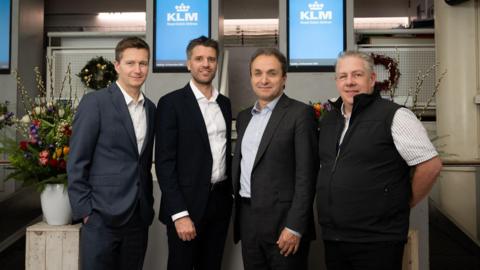 Stephen King, Chief Operations Officer, Ports of Jersey, Chris Van Erp - KLM Commercial Director UK&I, Jerome Salemi - KLM General Manager UK&I and Paul Holley, Head of Route Development, Ports of Jersey. They are all pictured standing wearing smart work clothes
 