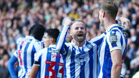 Barry Bannan and Michael Smith celebrate