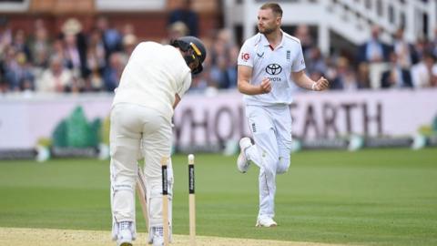 Gus Atkinson celebrates after bowling out Matt Henry