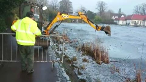 ice being broken with digger