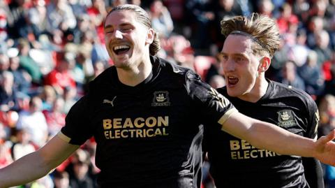 Lorent Tolaj celebrates scoring for Plymouth Argyle