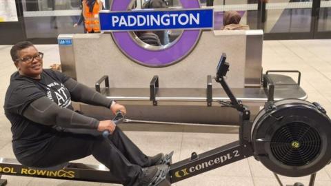A participant rows at Paddington station.
