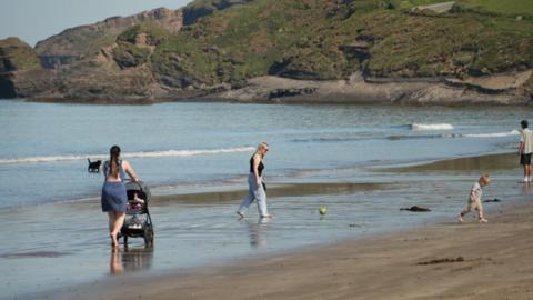 A group of people on a sunny beach