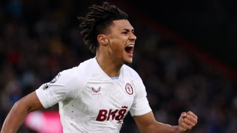 Villa striker Ollie Watkins roars in celebration after his headed equaliser