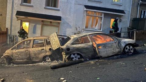 Burned out cars in Mayhill