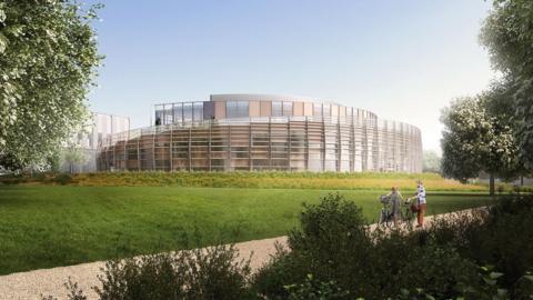 An artistic impression of what one of the buildings at Marlow Film Studios could look like, a reflective modern building surrounded by trees, greenery and a cycle path.