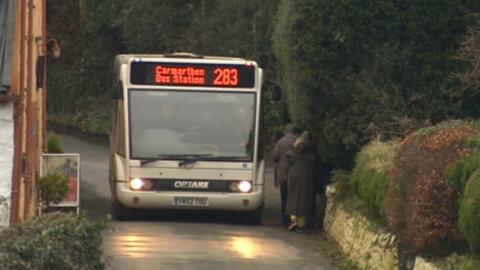 Photo of passengers board a rural bus