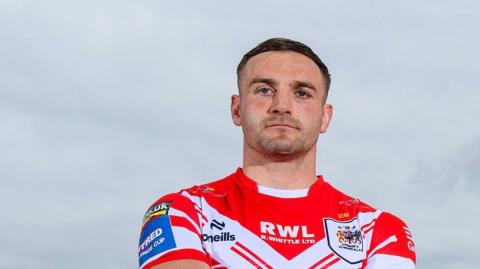 Matty Lees stands during a press shot before St Helens' Challenge Cup semi-final against Wigan Warriors