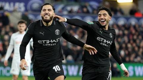 Rayan Cherki of Manchester City celebrates scoring his team's third goal with Omar Marmoush