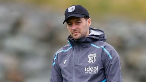West Brom head coach Ryan Mason watches training