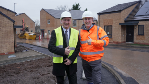 Councillor Steve Evans and Gavin Ward, from developer Morro Partnerships at the development where the homes are close to completion. They are built in a light brown colour brick with black roofs and solar panels