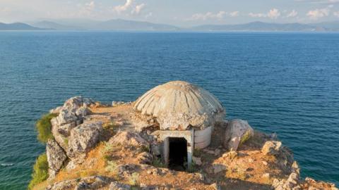 A bunker on a cliff next to the sea in Albania