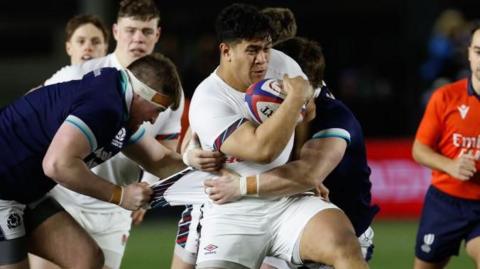 Kepu Tuipulotu carrying the ball against Scotland