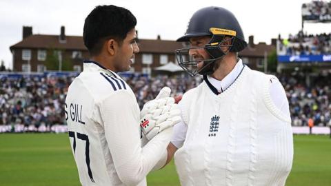 Shubman Gill (left) shakes hands with Chris Woakes after India win the fifth Test at The Oval