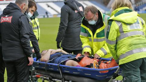 Jordan Morris is taken off on a stretcher