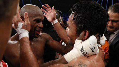 Floyd Mayweather embraces Manny Pacquiao in the ring after their fight