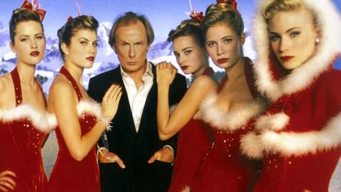 Bill Nighy and women dressed as Santa in Love Actually
