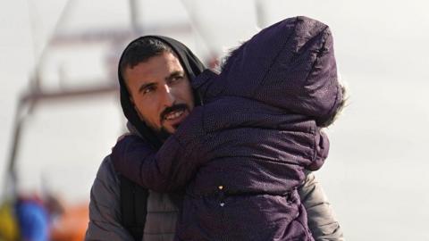 Migrants being brought ashore at Dungeness