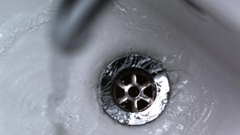 Water running down a plughole