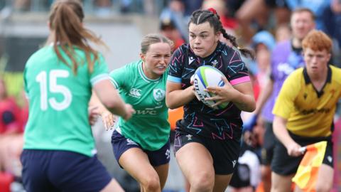 Wales' Chiara Pearce takes on Niamh Gallagher of Ireland in the Six Nations Summer Series game at Ystrad Mynach