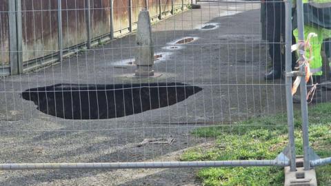 A sinkhole in a road in Littlehampton.