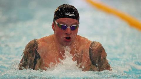  Adam Peaty competing in 100m breaststroke 